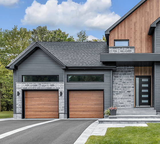 Garaga residential garage door with a Cedar HD faux-wood finish and the Plank design.