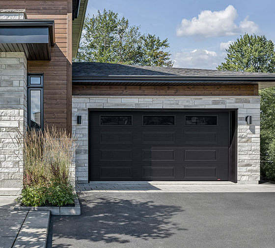 Garaga residential garage door in Black with the Prestige XL design and Black Satin glass.