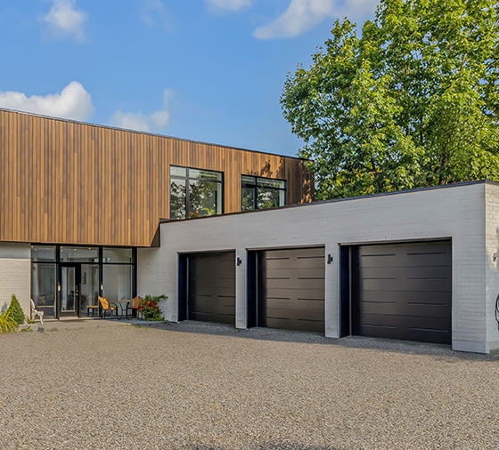 Garaga residential garage door in Black with the Vogue design.