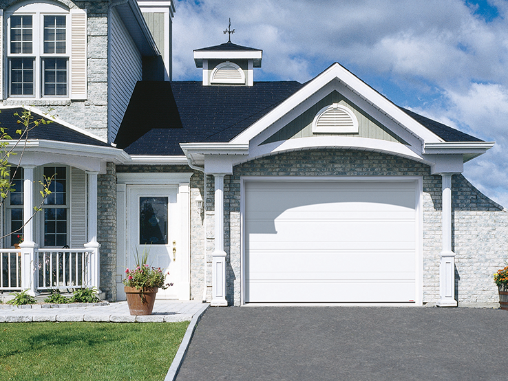 Garaga residential garage door in Tex White with the 2 Grooves design.
