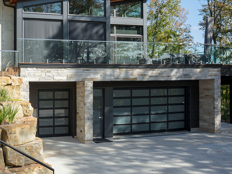 Garaga residential garage door with the Grid and Center all-glass design, Black frame and White Sandblasted glass.