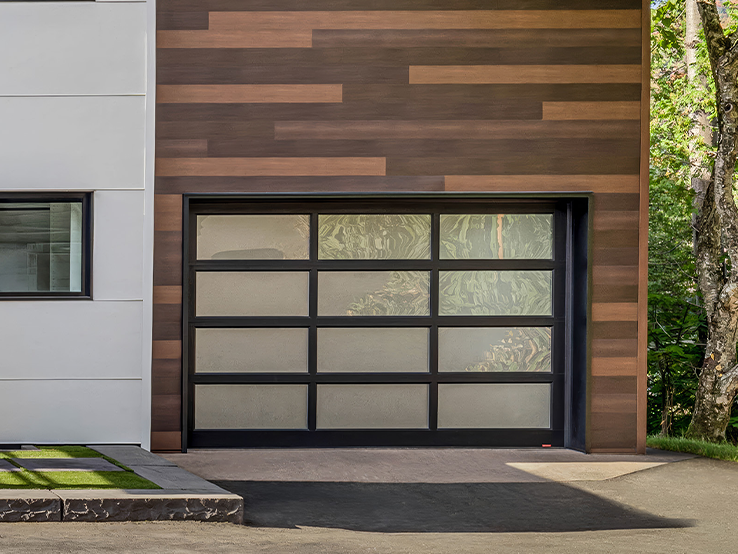 Garaga residential garage door with the Grid all-glass design, Black frame and White Sandblasted glass.
