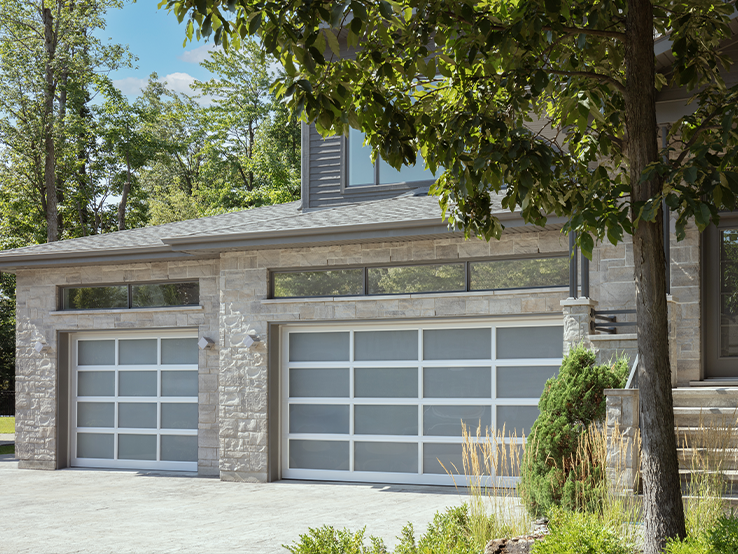 Garaga residential garage door with the Grid all-glass design, Anodized frame and White Sandblasted glass.