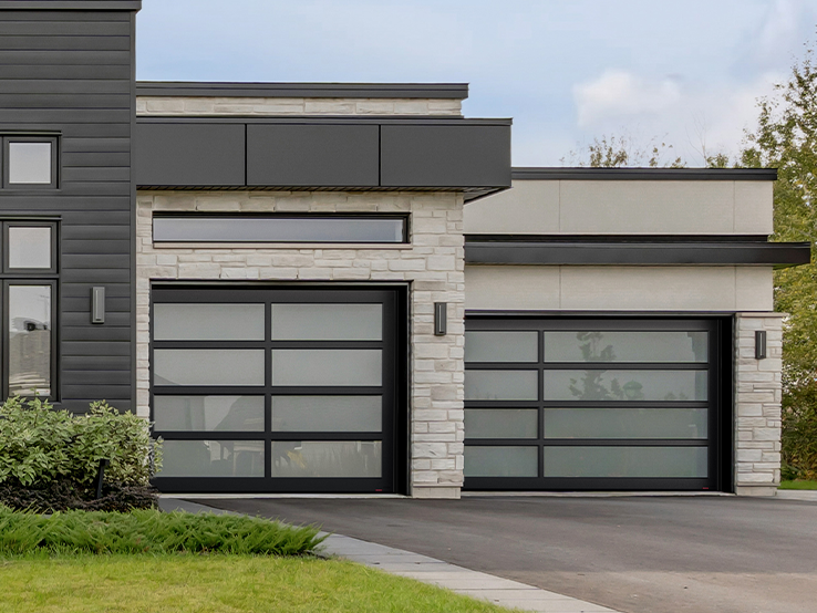 Garaga residential garage door with the Center & Offset all-glass design, Black frame and White Sandblasted glass.