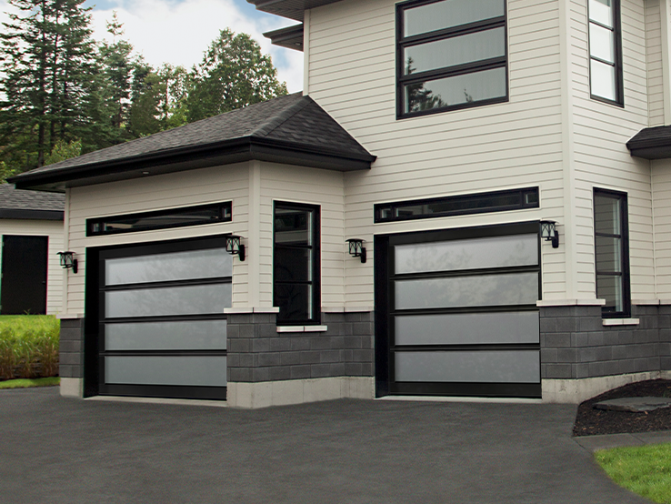 Garaga residential garage door with the Total all-glass design, Black frame and White Sandblasted glass.