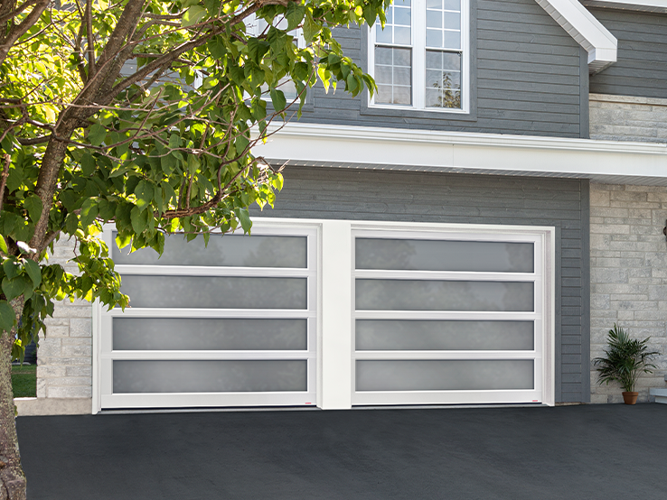 Garaga residential garage door with the Total all-glass design, White frame and White Sandblasted glass.