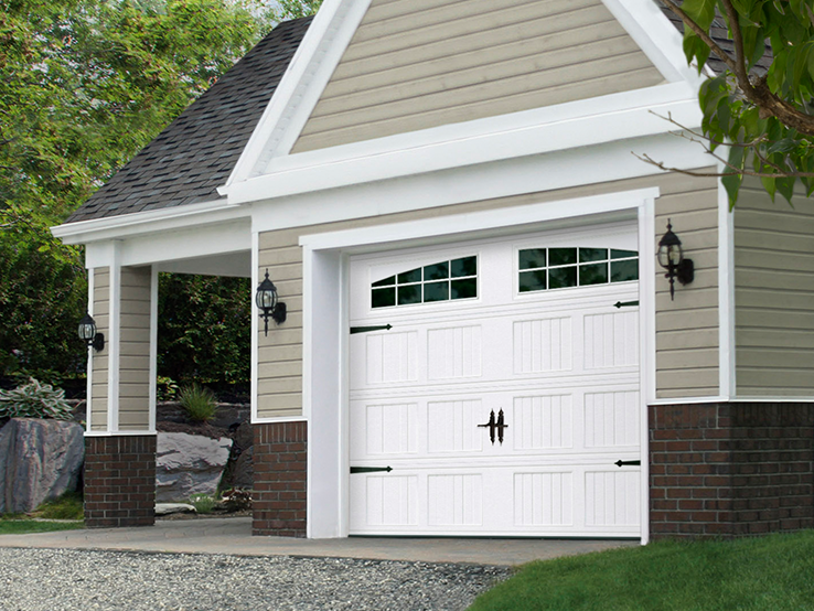 Garaga residential garage door in White with the Beadboard Short design and Double Stockton Arch window inserts.