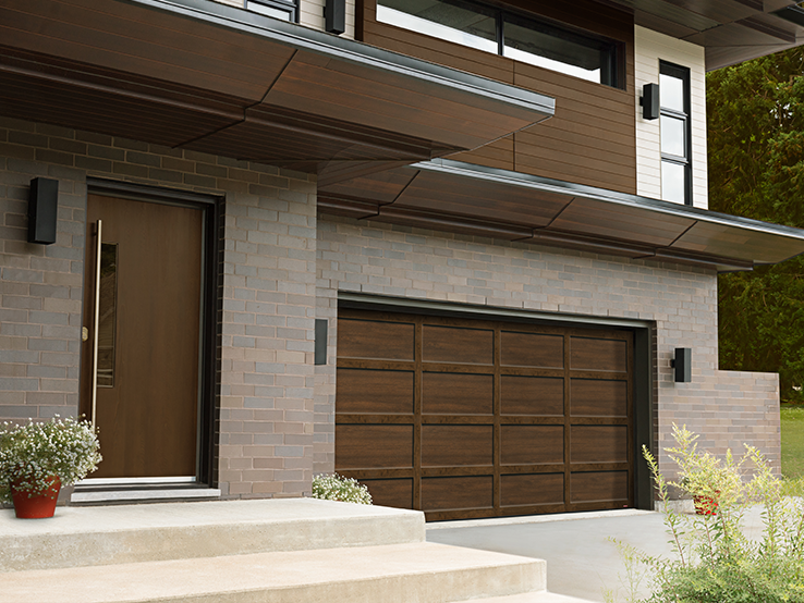 Garaga residential garage door with a Chocolate Walnut faux-wood finish, the CL design and matching overlays.