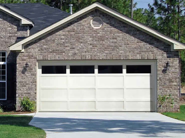 Garaga residential garage door in Ice White with the CL design, matching overlays and Panoramic windows.