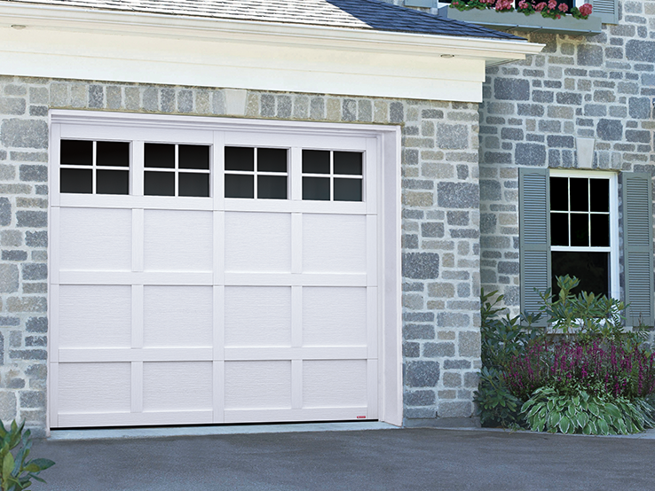 Garaga residential garage door in Ice White with the CM design, matching overlays and Panoramic windows.