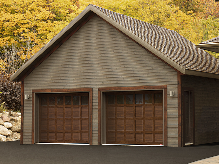 Garaga residential garage door with a Chocolate Walnut faux-wood finish, the CS design, matching overlays and Panoramic windows.