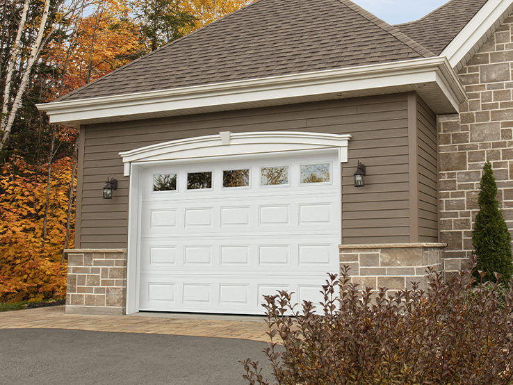 Garaga residential garage door in Ice White with the Classic CC design and Clear glass.