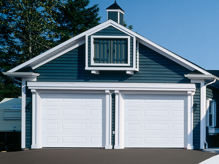 Garaga residential garage door in Ice White with the Classic Mix design.