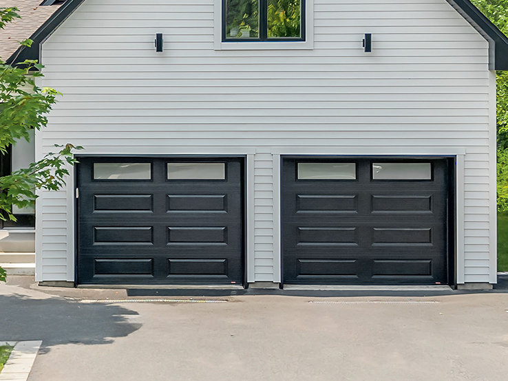 Garaga residential garage door in Black with the Classic XL design and White Sandblasted glass.