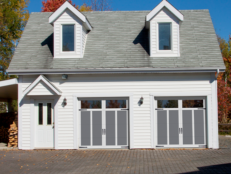 Garaga residential garage door in Charcoal with the E-12 design, Ice White overlays and Panoramic windows.