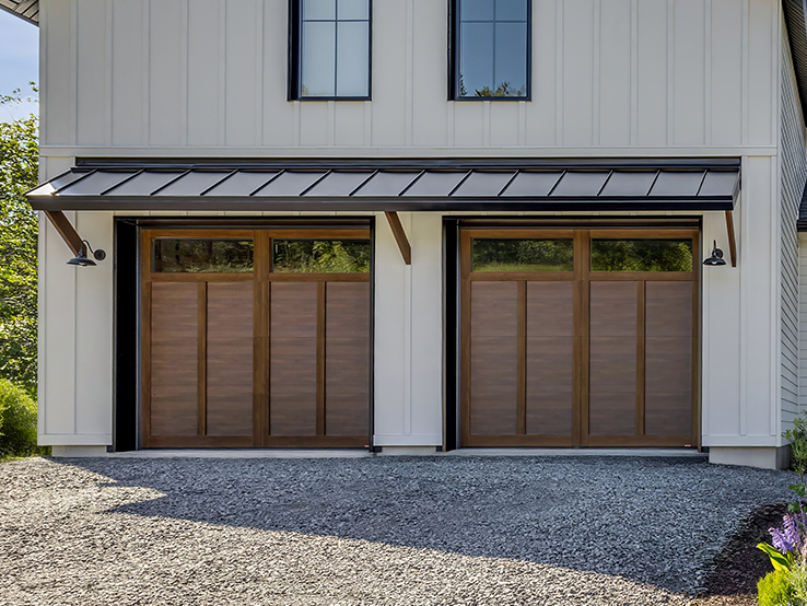 Garaga residential garage door with a Chocolate Walnut faux-wood finish, the E-12 design and matching overlays.
