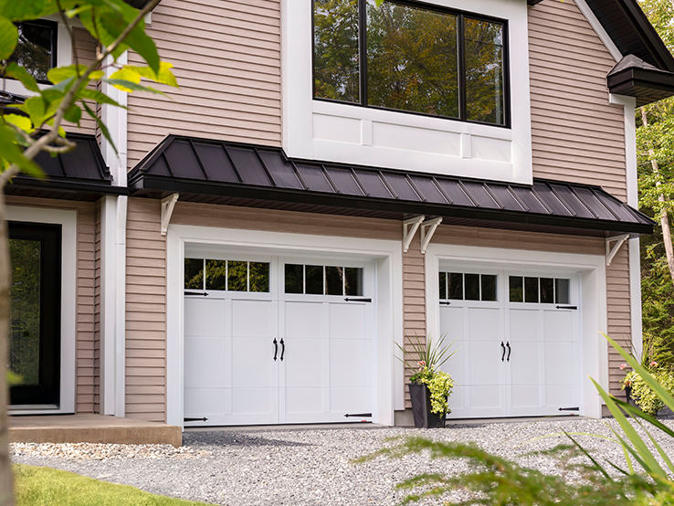 Garaga residential garage door in Ice White with the E-12 design, matching overlays and decorative hardware.