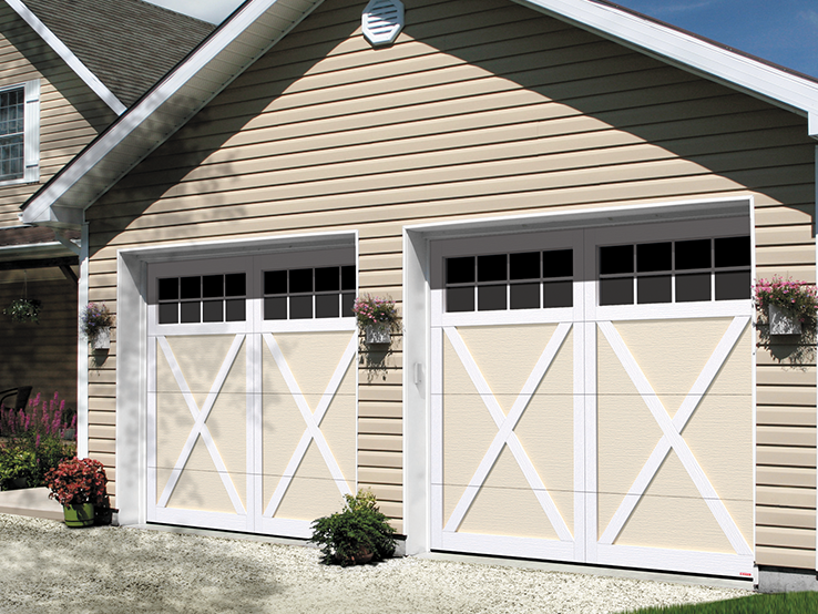 Garaga residential garage door in Desert Sand with the E-21 design, Ice White overlays and Panoramic windows.
