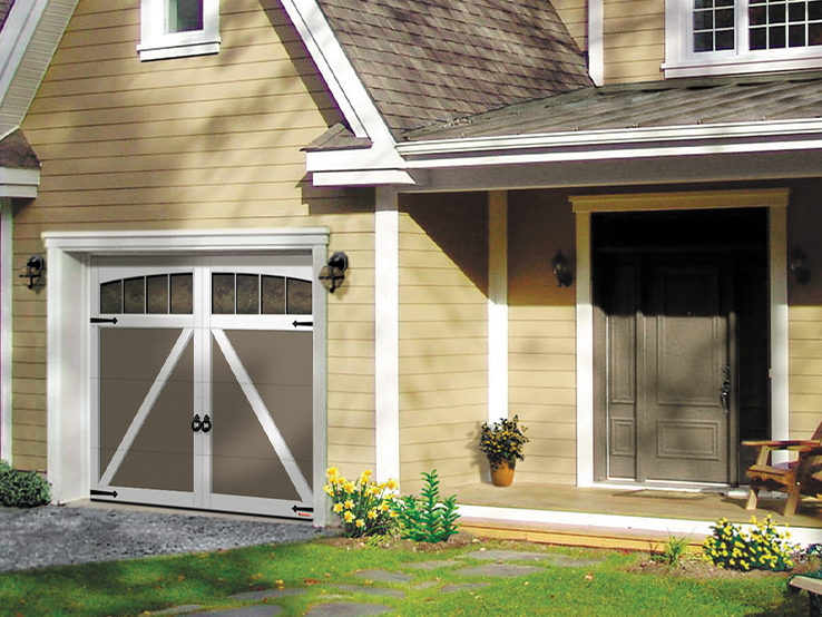 Garaga residential garage door in Dark Sand with the E-22 design, Ice White overlays and Arch Overlays.