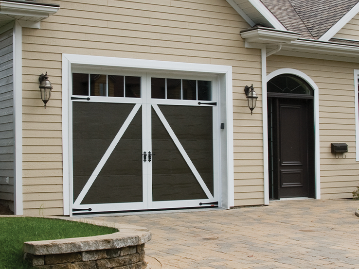 Garaga residential garage door in Moka Brown with the E-22 design, Ice White overlays and Panoramic windows.