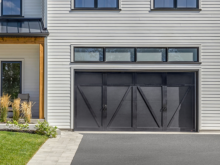 Garaga residential garage door in Black with the E-23 design and matching overlays.
