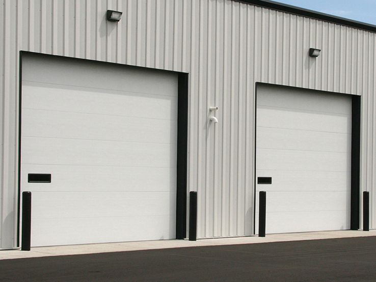 Garaga 16' x 14' commercial garage door in White with the Flush design, one window and Uniform woodgrain steel.