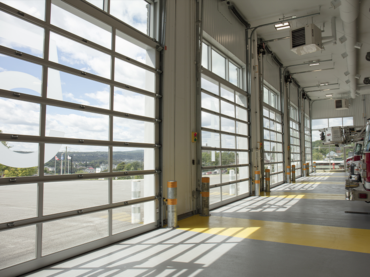 Garaga G-4400 commercial garage doors, 13-1/2' x 14' all-glass, Anodized frame and Clear glass.