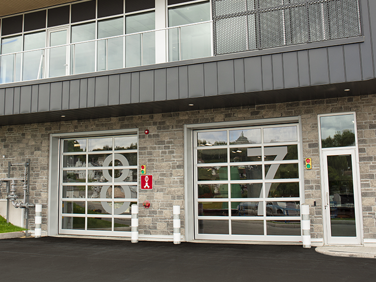 Garaga G-4400 commercial garage doors, 11' x 12' all-glass, Anodized frame and Clear glass.
