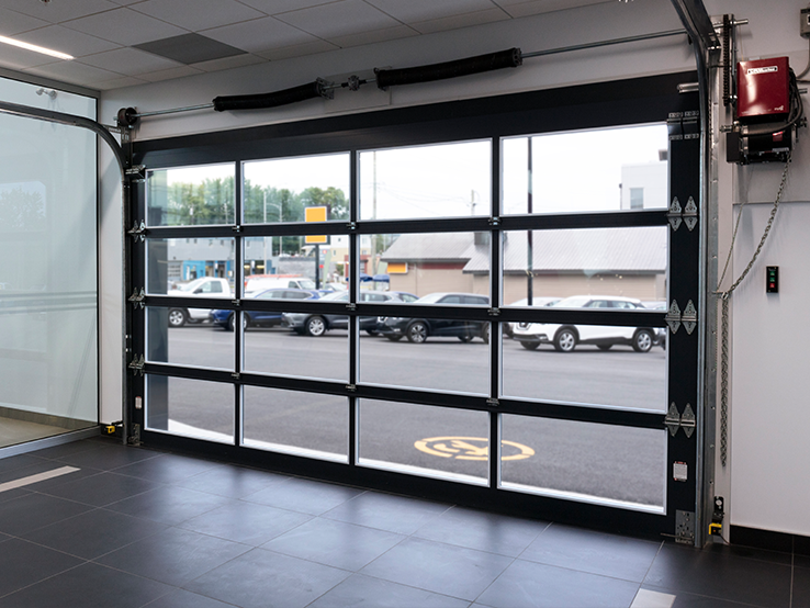 Garaga G-4400 commercial garage doors, 14' x 8' all-glass, Black frame and Clear glass.