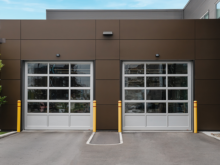 Garaga G-4400 commercial garage doors, 10' x 10' all-glass, Anodized kick-proof panel, Anodized frame and Clear glass.