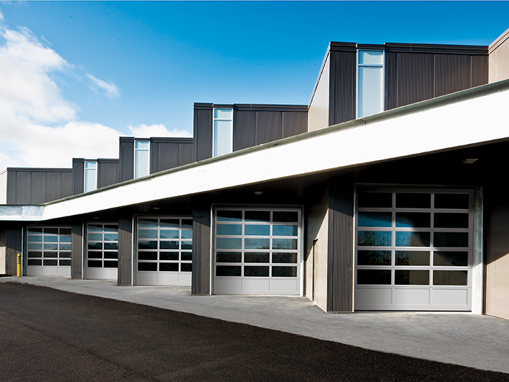 Garaga G-4400 commercial garage doors, 10' x 12' all-glass, Anodized kick-proof panel, Anodized frame and Clear glass.