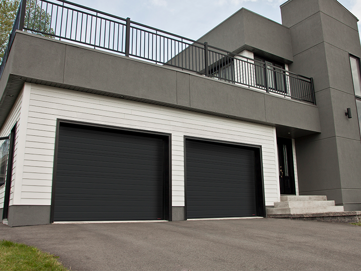 Garaga residential garage door in Black with the Grooved design.