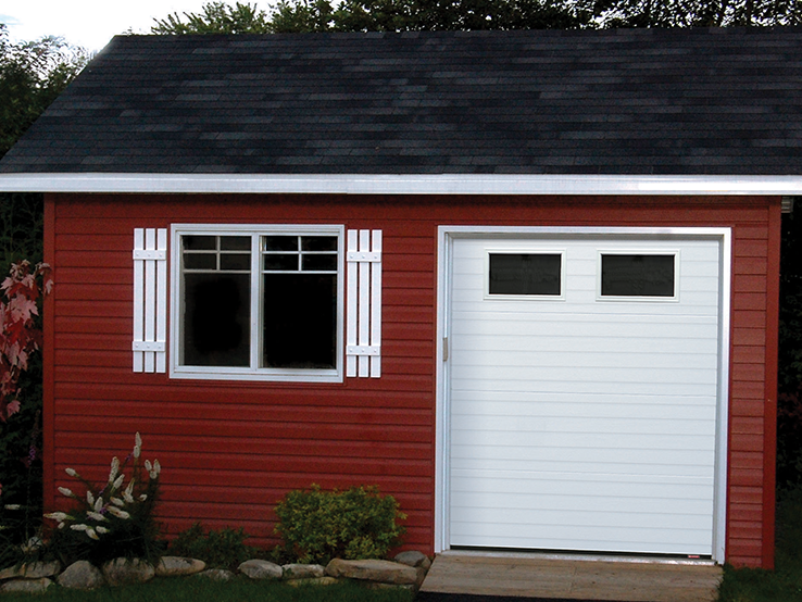 Garaga residential garage door in Ice White with the Grooved design and Clear glass.