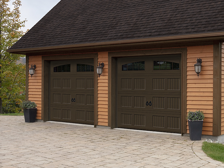 Garaga residential garage door in Brown with the I1 design, a beadboard base and Richmond Arch window inserts.