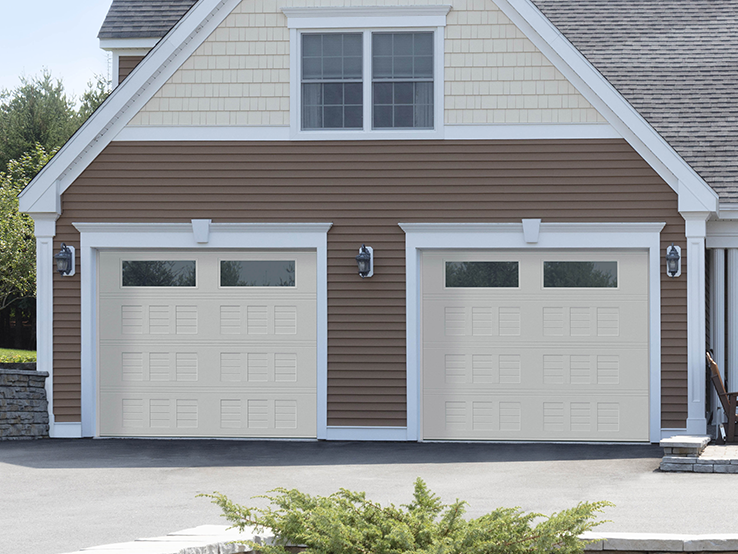 Garaga residential garage door in Sahara with the I2 design, a four-slat louver base and Clear glass.