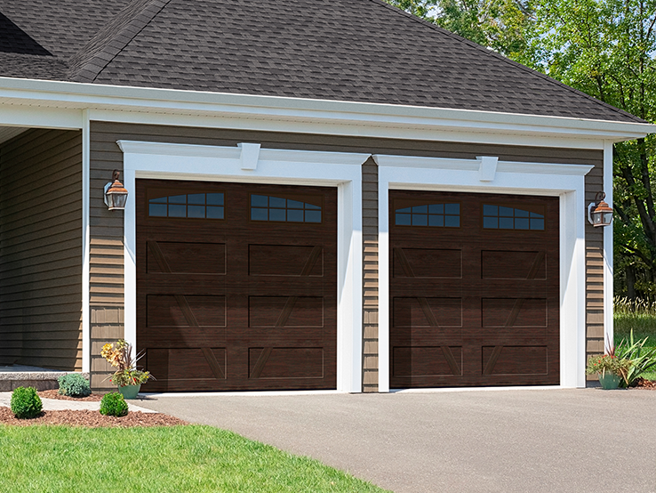 Garaga residential garage door with a Dark Walnut faux-wood finish, the V design, a recessed base and Double Stockton Arch window inserts.