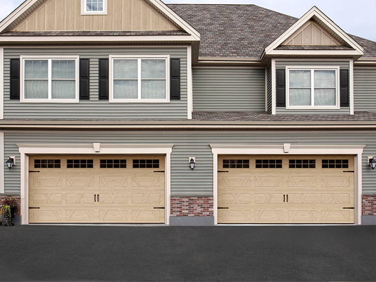 Garaga residential garage door with a Natural Oak HD faux-wood finish, the X design, a recessed base and windows.