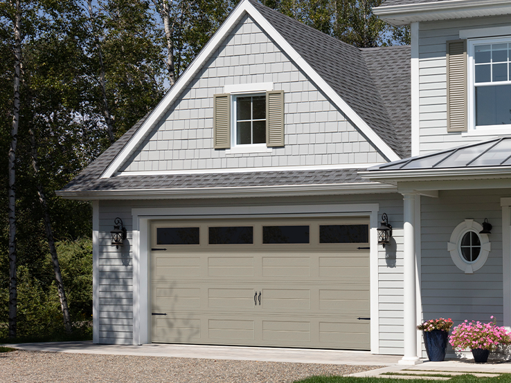 Garaga residential garage door in Sandstone with the Louver Two Slat design and Clear glass.