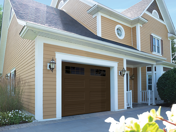 Garaga residential garage door in Brown with the Louver Four Slat design and Stockton window inserts.