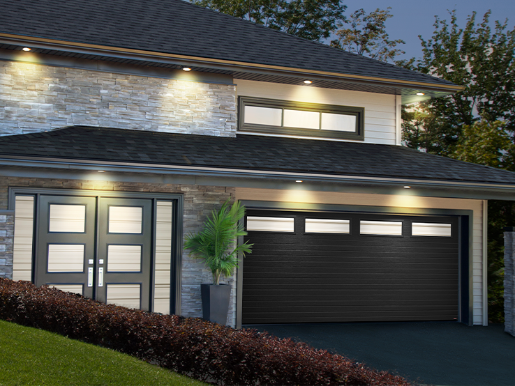 Garaga residential garage door in Black with the Moderno Multi design and windows.