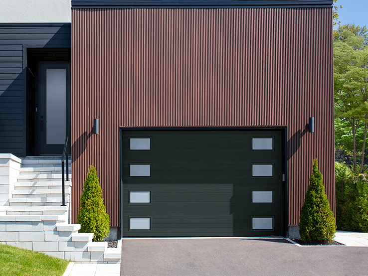 Garaga residential garage door in Iron Ore with the Moderno Multi design and Outer Harmony windows.