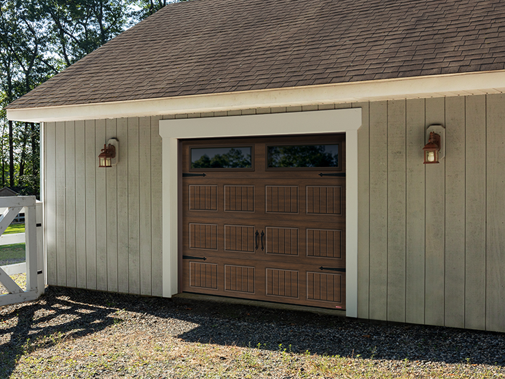 Garaga residential garage door with a Chocolate Walnut faux-wood finish, the North Hatley SP design and Clear glass.