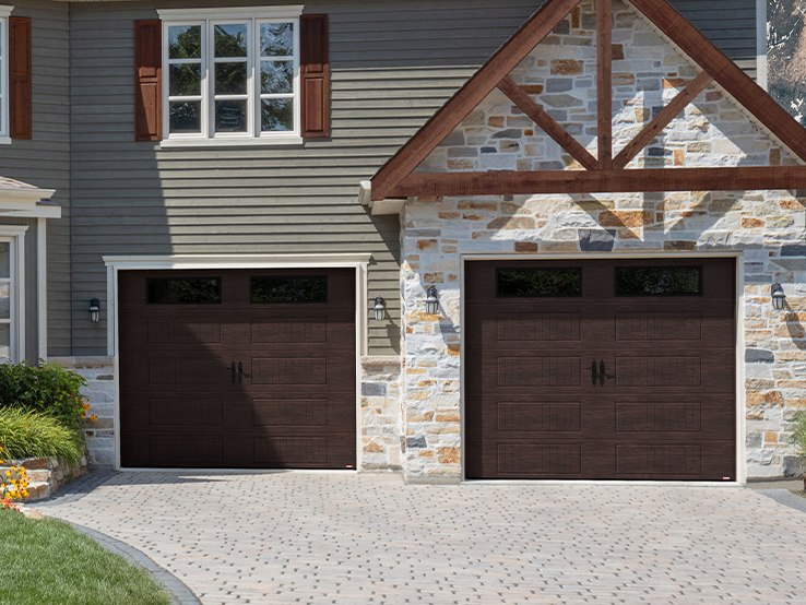 Garaga residential garage door with a Dark Walnut faux-wood finish, the North Hatley LP design and Clear glass.