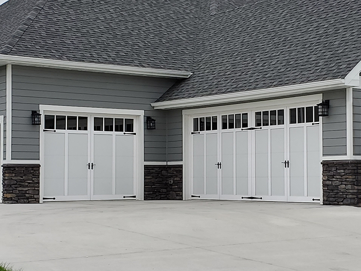 Garaga residential garage door in White with the I1 design, matching overlays and Richmond windows.