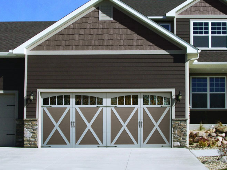 Garaga residential garage door in Terrastone with the X design, White overlays and Richmond Arch windows.