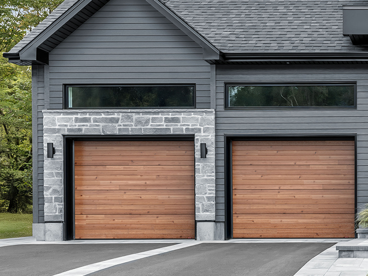Garaga residential garage door with a Cedar HD faux-wood finish and the Plank design.