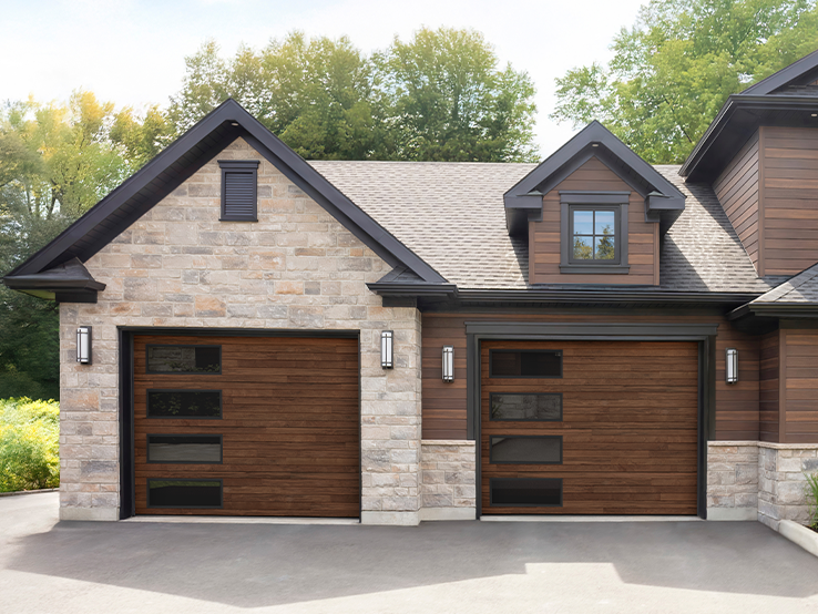 Garaga residential garage door with a Dark Acacia HD faux-wood finish, the Plank design and Harmony Long windows.