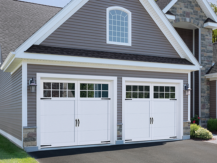 Garaga residential garage door in Ice White with the P-11 design, matching overlays and Panoramic windows.