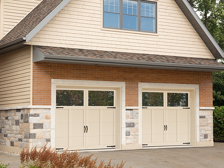 Garaga residential garage door in Desert Sand with the P-12 design, matching overlays and Panoramic windows.