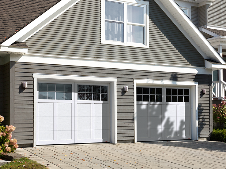 Garaga residential garage door in Ice White with the P-12 design, matching overlays and Panoramic windows.